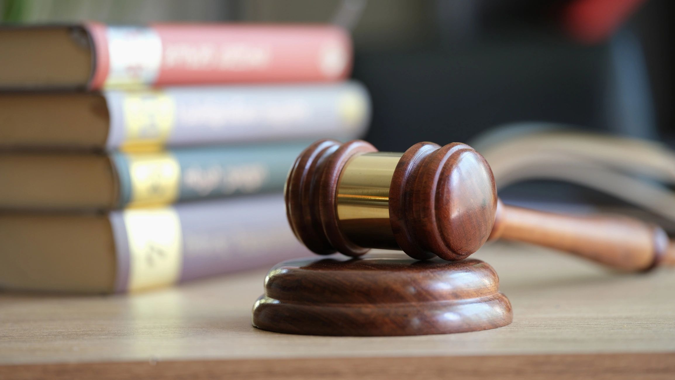 Law books and judge gavel representing the rule of law